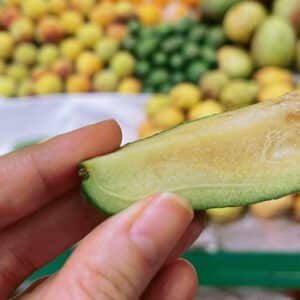 feijoa cut in four pieces ready for the tasting at Paloquemao