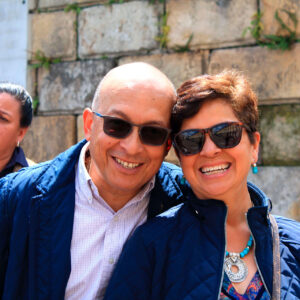 happy_couple_traveling_colombia_visit_candelaria_historical_neighborhood_zebra_fisgona_tours_city_tour_bogota