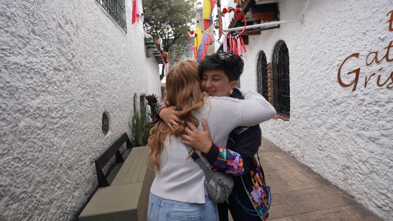 Local friend Aleja and visitor hugging after incredible day together in Bogota